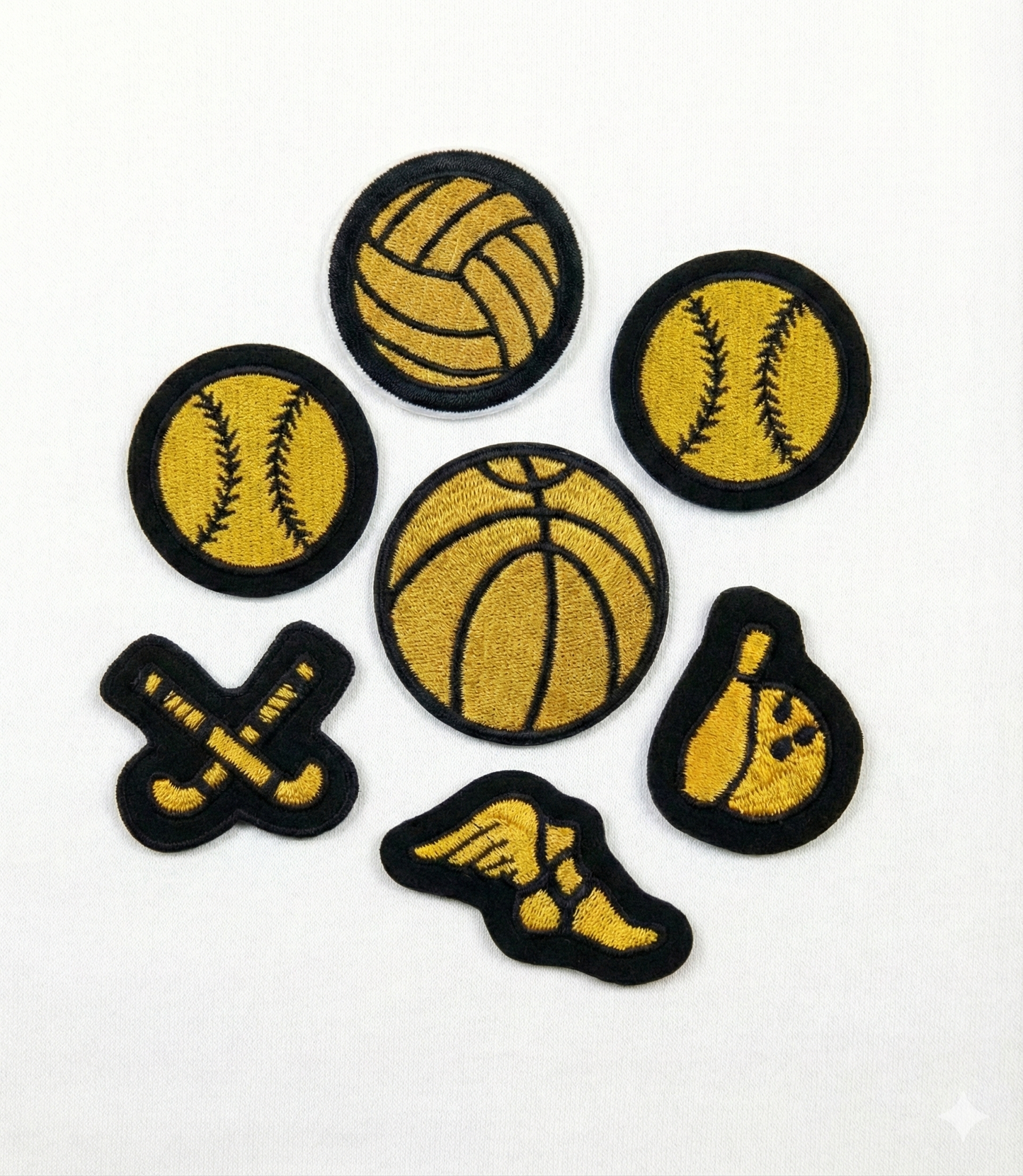 Set of sports-themed patches including basketball, baseball, softball, and bowling ball on a white background.
