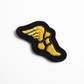 Black and yellow embroidered patch on a white background
