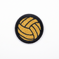 Patch of a yellow volleyball on a black border against a white background