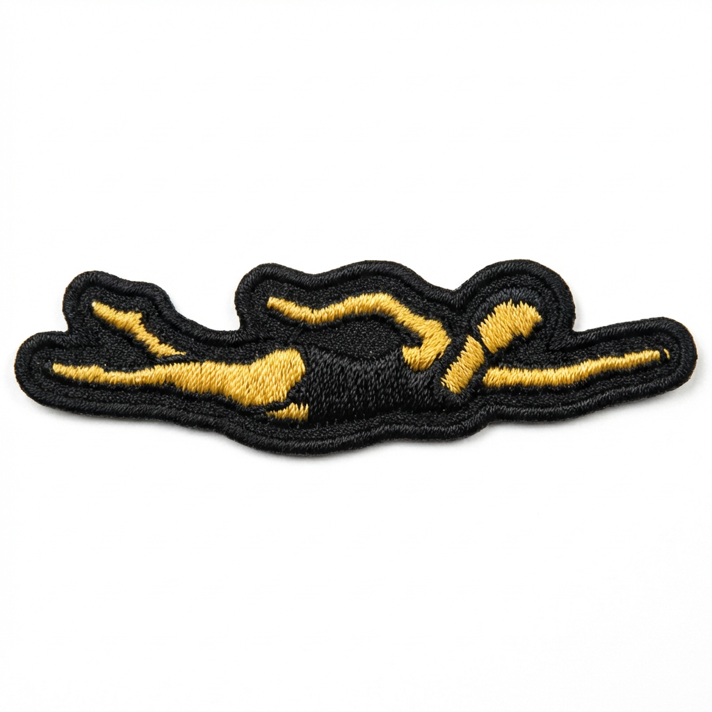 Black and gold embroidered patch on a white background